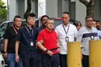 Singapore's Lengkok Bahru murder: Man accused of killing neighbour taken back to crime scene