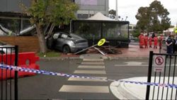 One dead, two hospitalised after car crashes into cafe at Melbourne shopping centre