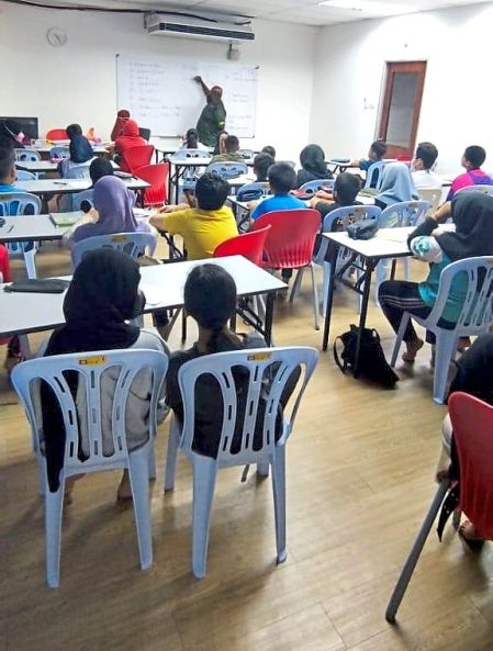 Heart of gold: Cikgu Rafi (below) said teaching is not just about getting better grades, but about helping families too. — Photo courtesy of Rafi Abdul Karim