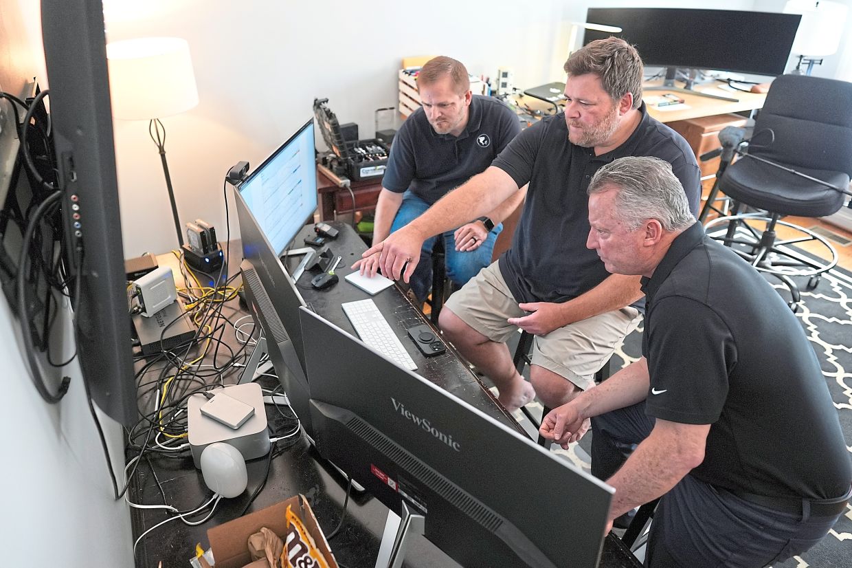 (From left) Leeper, Minkoff and Johnstone looking over weather data.