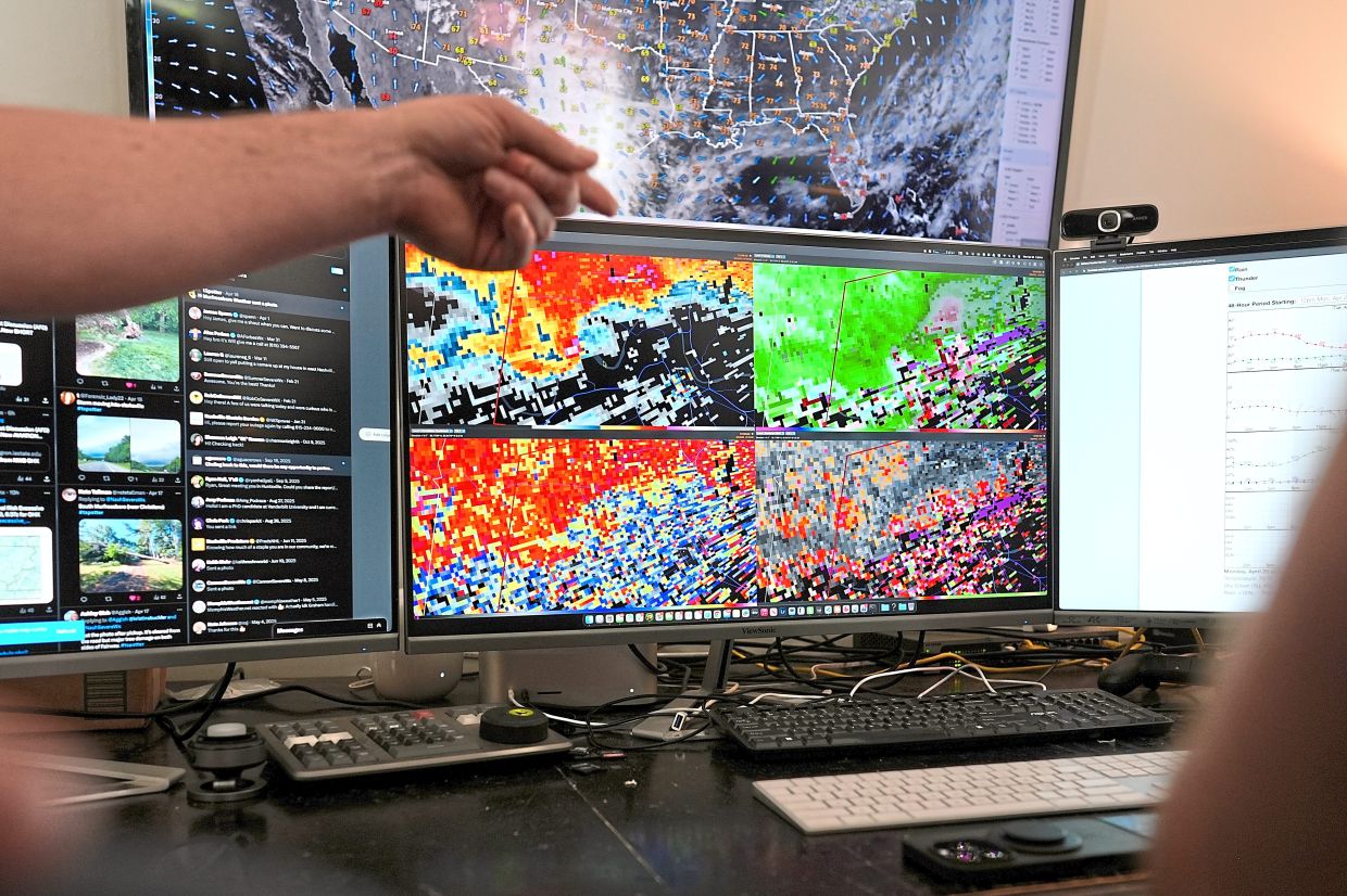 Weather information is displayed on a monitor at the Nashville Severe Weather headquarters.
