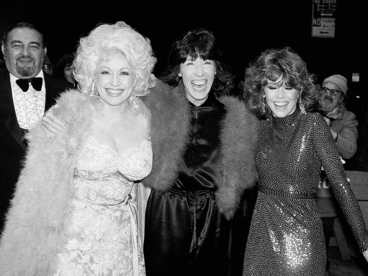 (From left) Dolly Parton, Lily Tomlin and Jane Fonda arrive for the premiere of their film '9 To 5' in New York on Dec 14, 1980. Photo: AP