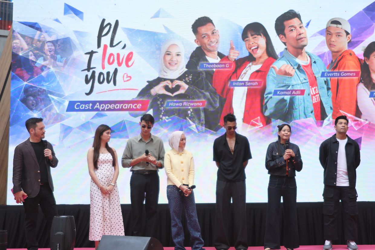 Host Adam Carruthers (far left) with the cast of ‘PL, I Love You’ on stage. From second left are Nina Jasmine, Evertts Gomes, Hawa Rizwana, Theeban G, Intan Serah and Kamal Adli.