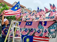 Indonesian-born’s daily ‘flag parade’ wins hearts around town