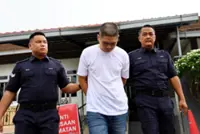 Used car dealer claims trial to firearm possession charge