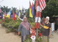 Elderly couple decorate home with discarded bottles for National Month