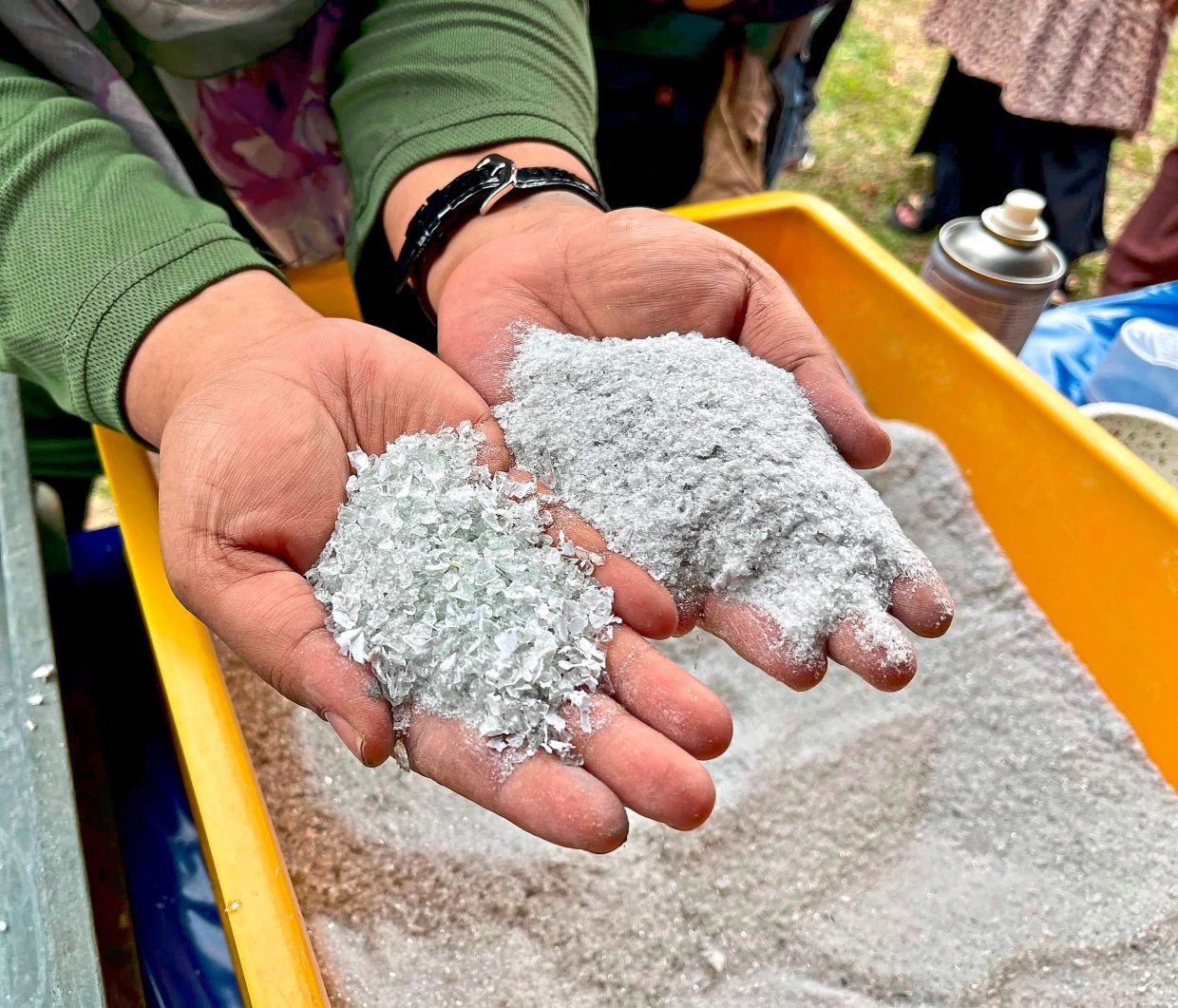 The output from the glass crushing machine - glass sand (right) and granules (left) - that can be mixed with other elements to produce new products.