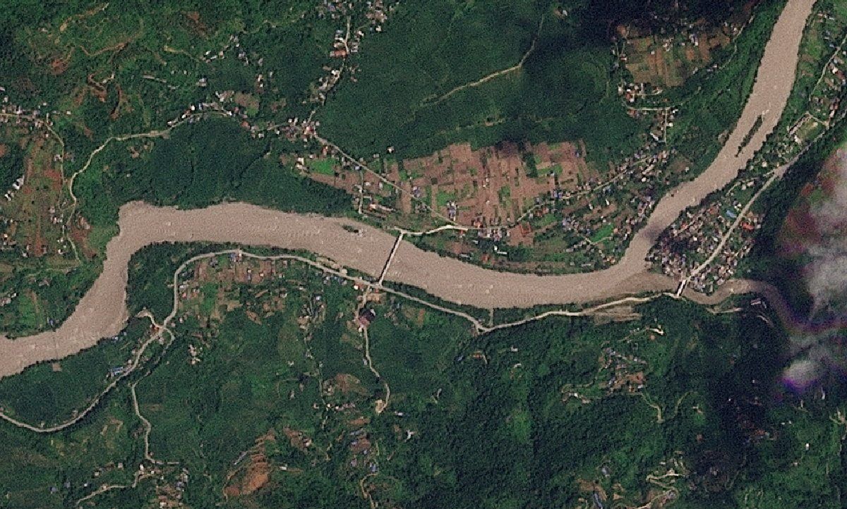 A satellite image shows Khadga Bhanjyang before a flash flood affected the area, Nepal, August 23, 2026. - Photo: 2026 PLANET LABS PBC/Handout via Reuters