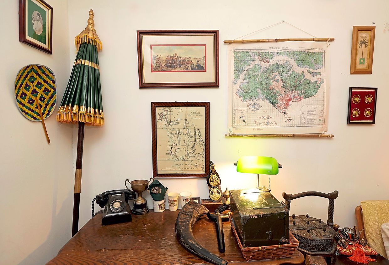 A space used for gatherings with other re-enactors, Mohamad Alif's room is filled with vintage paraphernalia. Photo: The Star/Chan Tak Kong