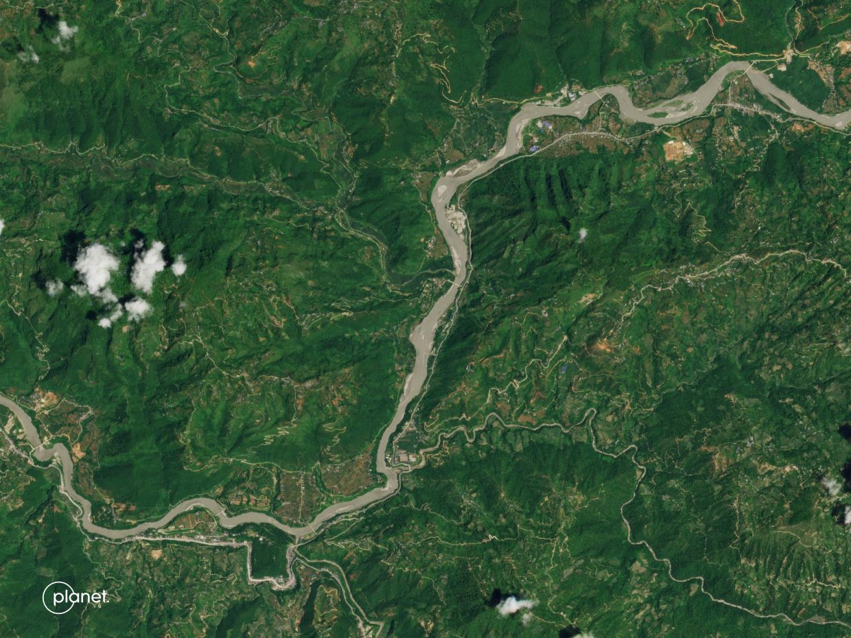 This handout satellite image released by Planet Labs shows an aerial view of Kolpurtar in Nepal's Nuwakot District on Aug 12, 2026. - AFP