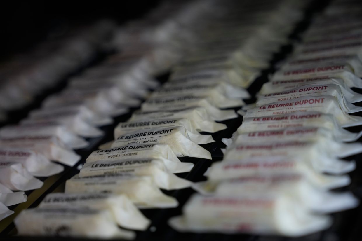 Packs of butter with different flavors are displayed in a refrigerator at Le Butter Shop, the first shop devoted entirely to butter in Paris.