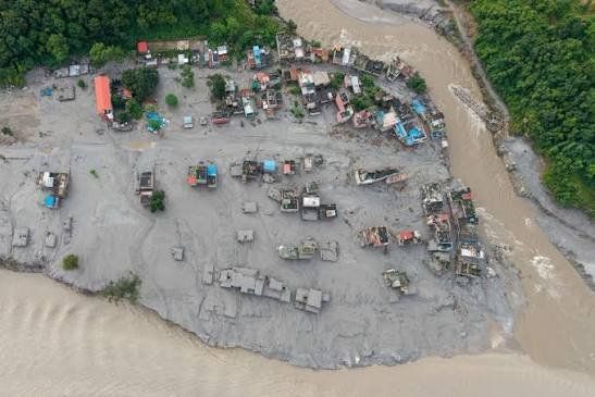 An aerial view shows houses lying deluged in sludge after flash floods at Devighat, Bidur Municipality in Nepal's Nuwakot district on August 27, 2026. - Photo: AFP