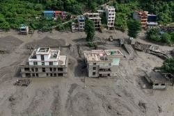Group of 10 missing Malaysians likely in valley when floods hit, says report