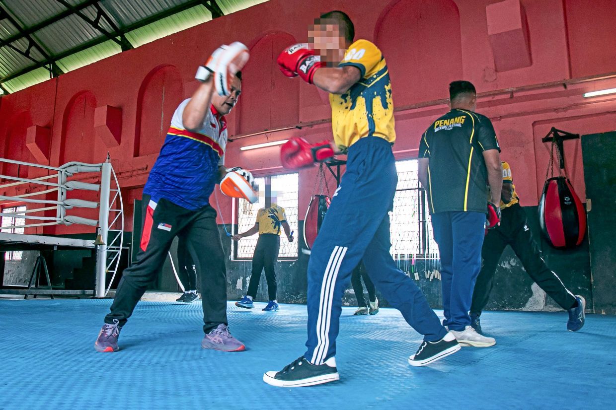 A student boxer from Sekolah Henry Gurney at a training session.