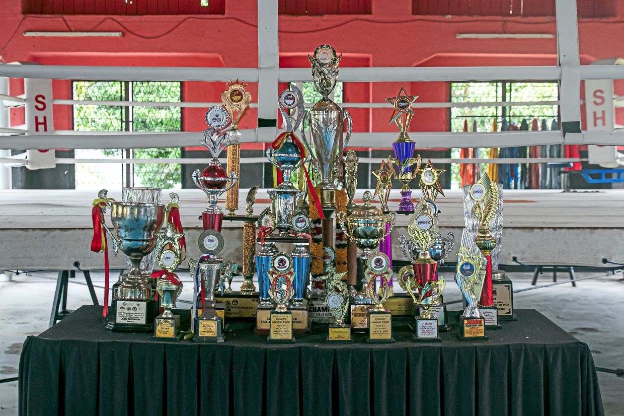 Trophies and medals won by Sekolah Henry Gurney trainees on display at the school in Melaka.