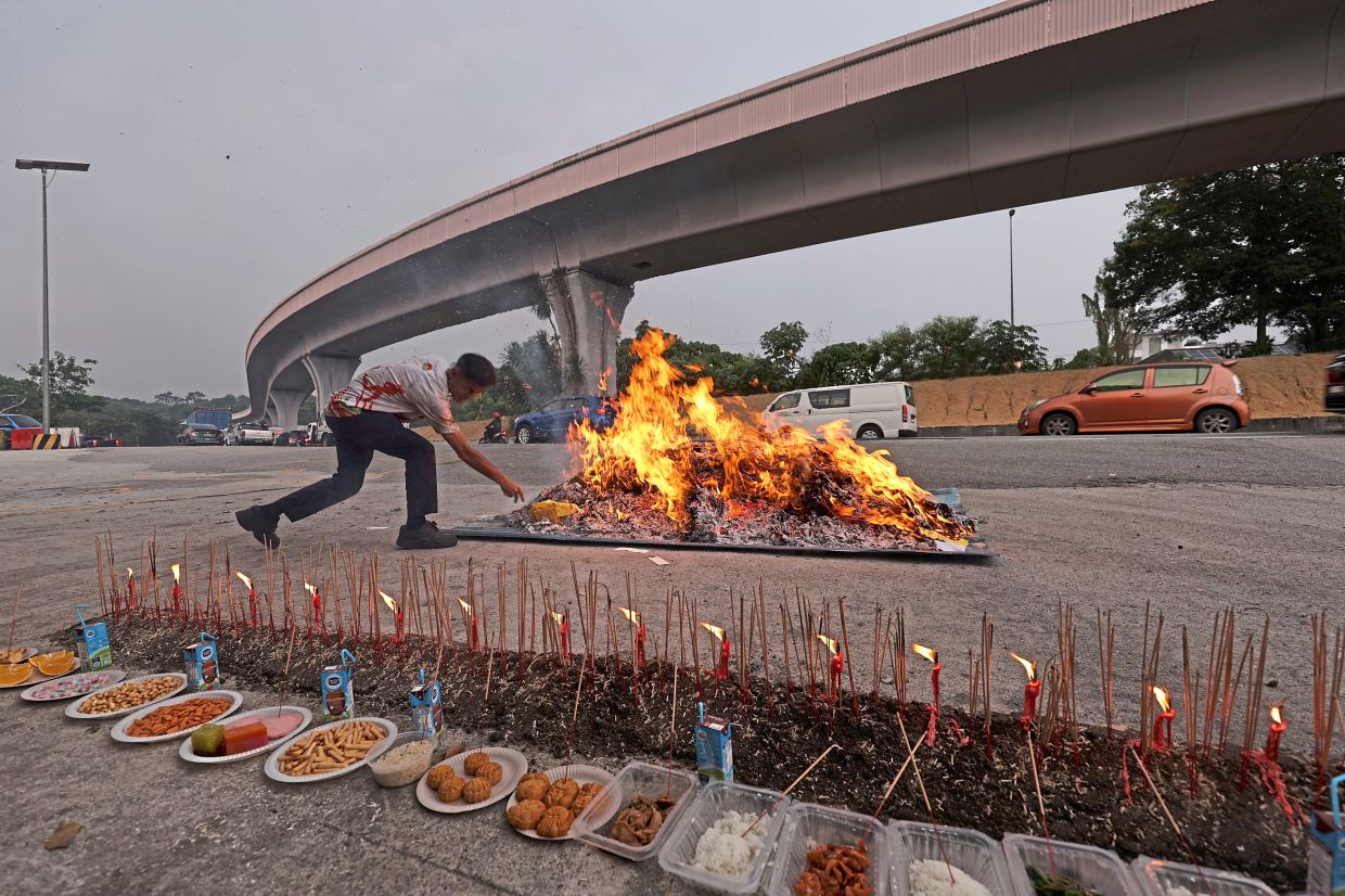 Tradition lights the way: Offerings laid out to mark the Hungry Ghost Festival.