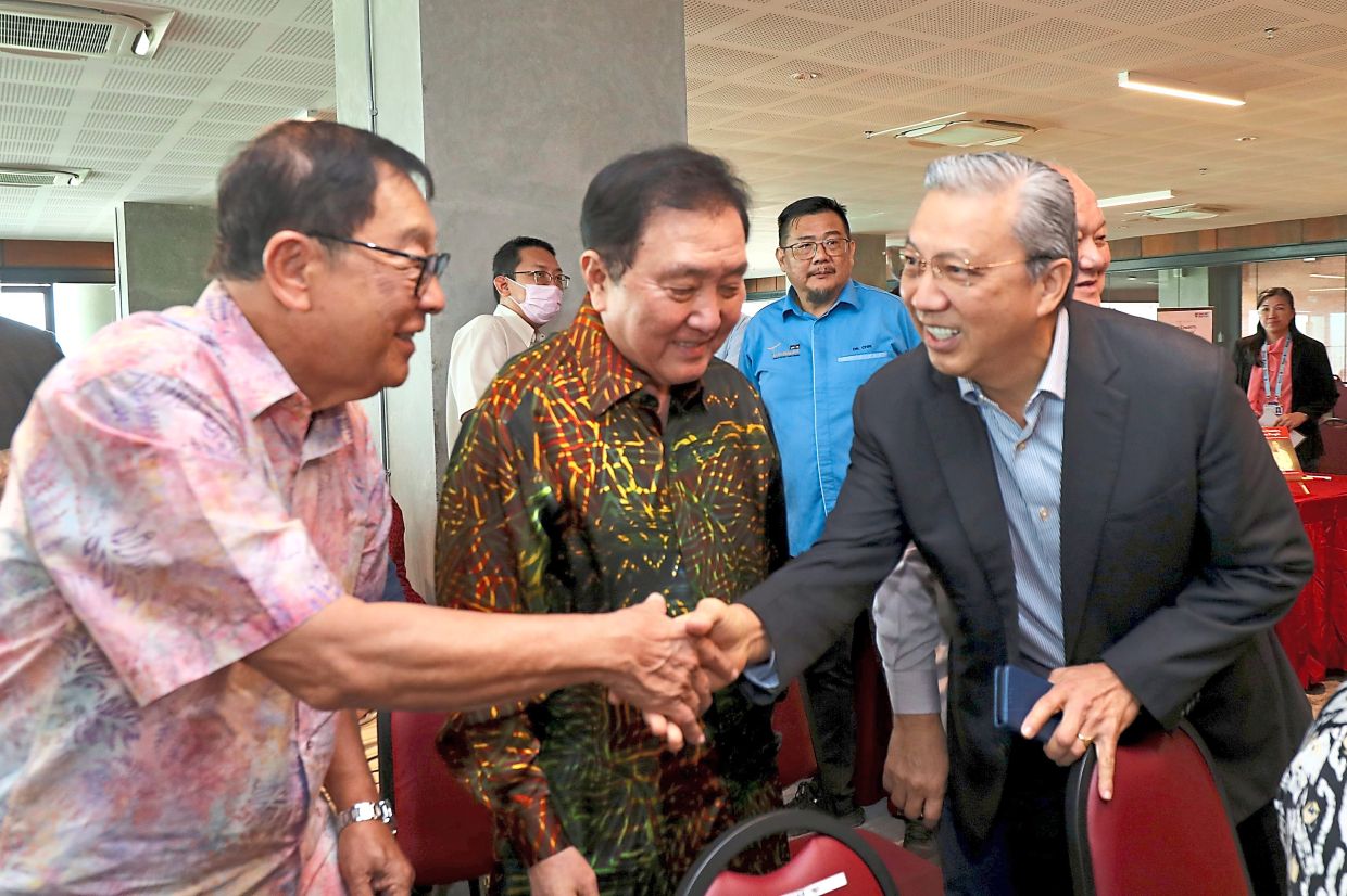Honouring the launch: Former MCA ministers (from left) Tan Sri Dr Fong Chan Onn, Tan Sri Ong Ka Chuan and Tan Sri Liow Tiong Lai were also present at the book launch. — LEONG WAI YEE/The Star