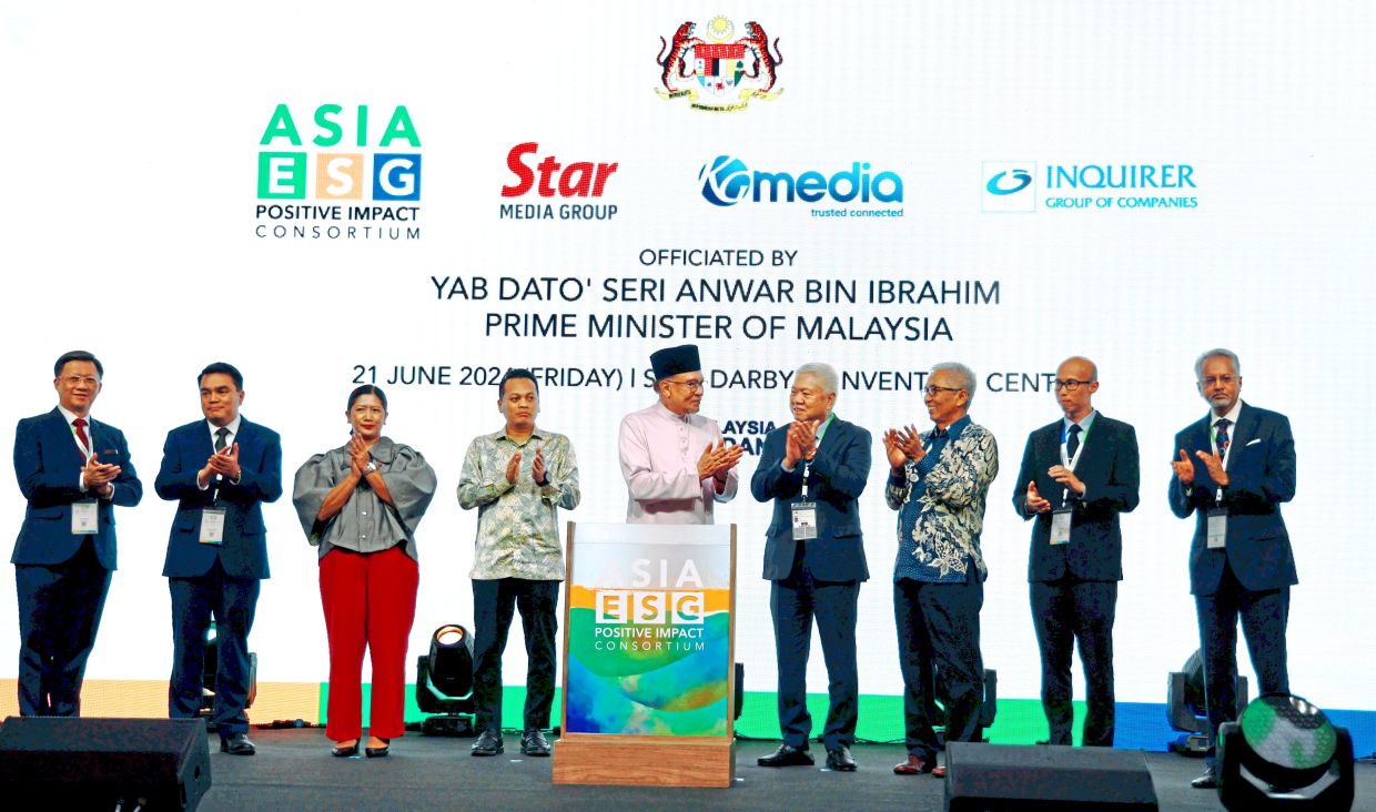 Prime Minister Datuk Seri Anwar Ibrahim (middle) launching the Asia ESG Positive Impact Consortium in June 2024. — NG KOK LEONG/The Star