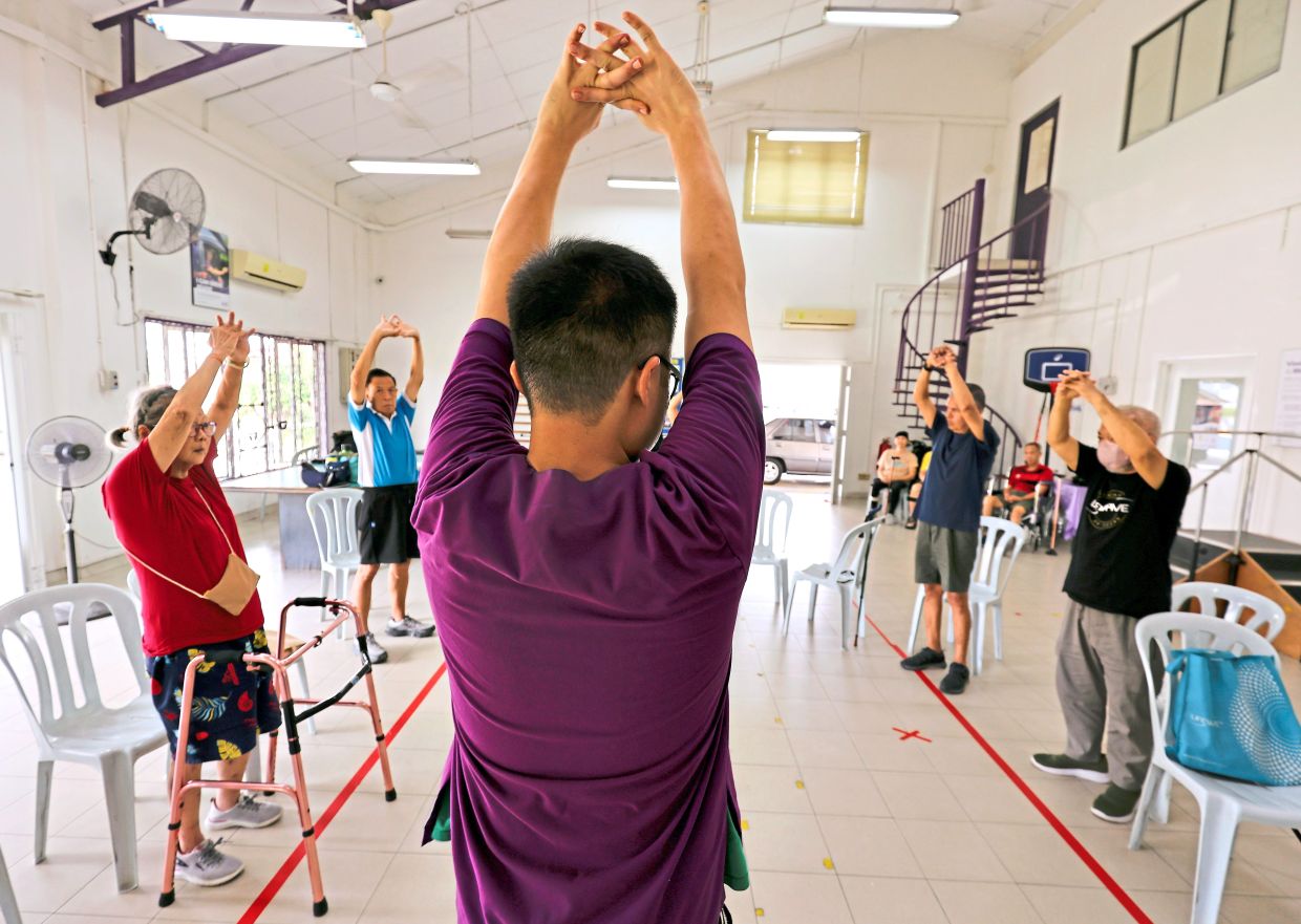 A group therapy session at Nasam’s first centre in Petaling Jaya, where stroke survivors exercise together in groups based on their functional levels, encouraging one another throughout their recovery.
