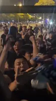 Angry Chinese Super League fans attack visiting team bus and make racist, offensive gestures