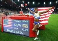 Athletics-American Russell hurdles to world record in Zurich