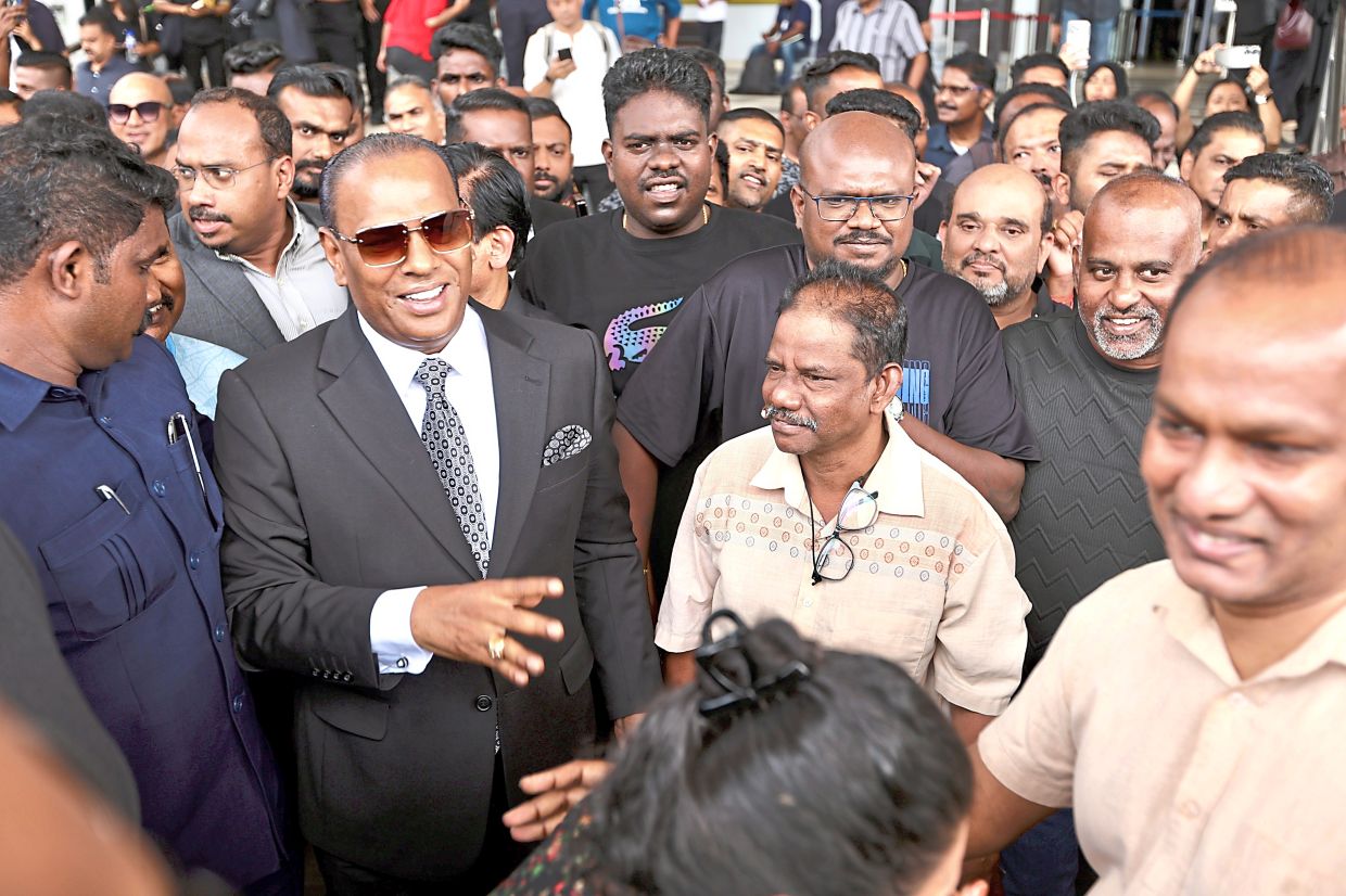 Seeking justice: Saravanan talking to journalists outside the Kuala Lumpur Sessions Court after he claimed trial to three corruption charges. He pleaded not guilty to all. — LOW BOON TAT/The Star