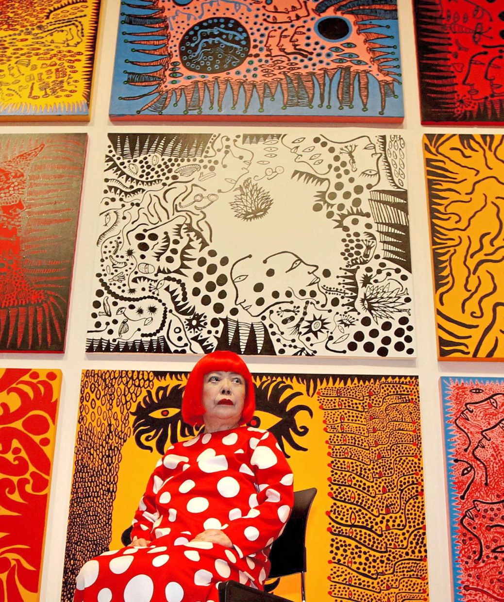A file picture of Kusama with her artwork, 'Love Arrives At The Earth Carrying With It A Tale Of The Cosmos', at the Tate Modern gallery in London in February 2012. Photo: Reuters