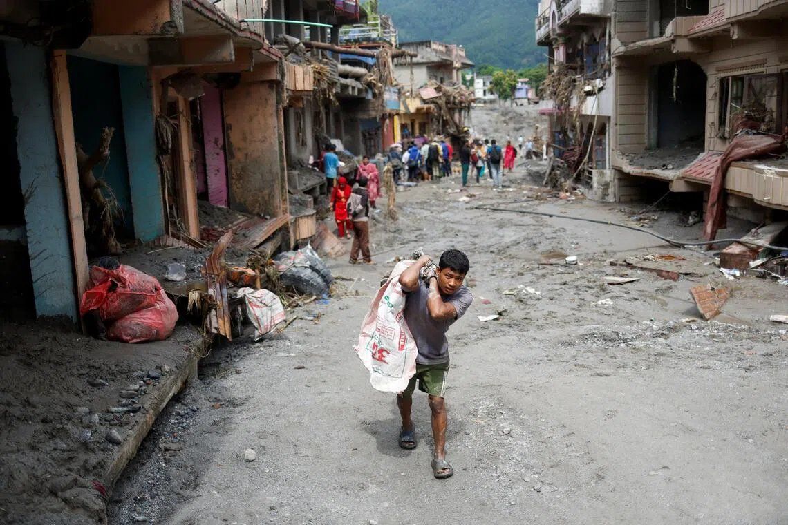 The number of missing soared close to 3,000 on Aug 29, with 633 bodies recovered. -- PHOTO: REUTERS