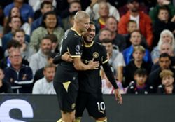 Soccer-Doubles for Cherki, Haaland as Man City cruise to 4-1 win over Palace