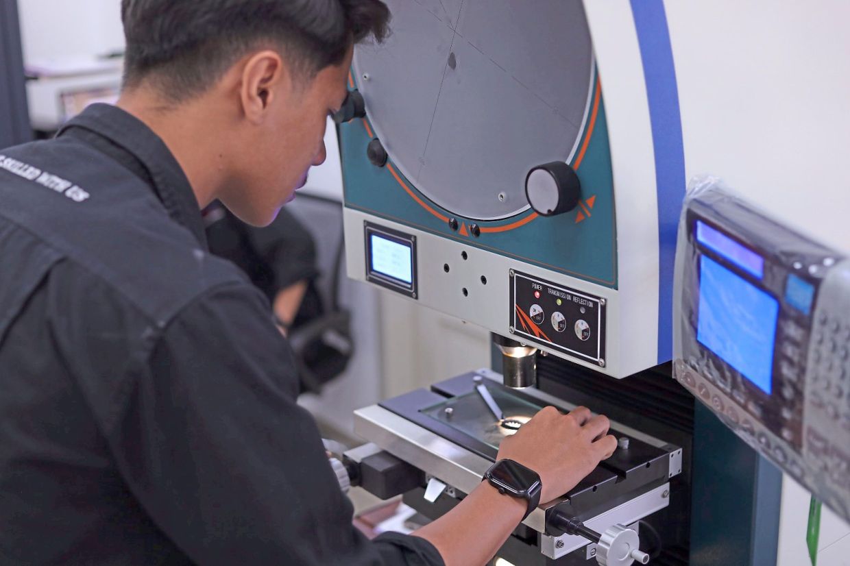 Practical skills: A student gaining hands-on experience as part of training designed to prepare students for the workplace.