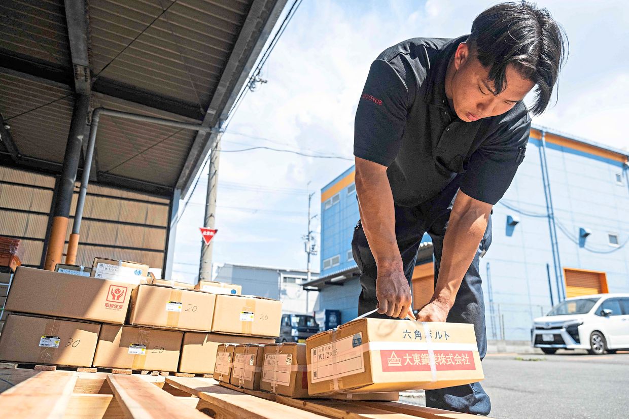 Taichi’s job involves moving heavy objects into warehouses, which can be very tough in the summer heat.