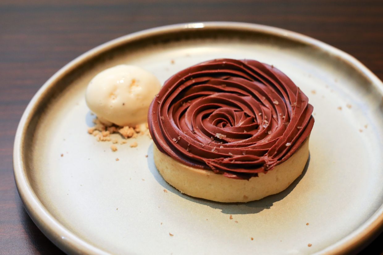 Chocolate, raspberry and hazelnut praline form the structural underpinnings of this fabulous dessert.