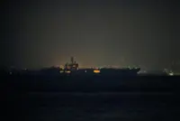 USS Abraham Lincoln sails past Singapore on its way home from Middle East
