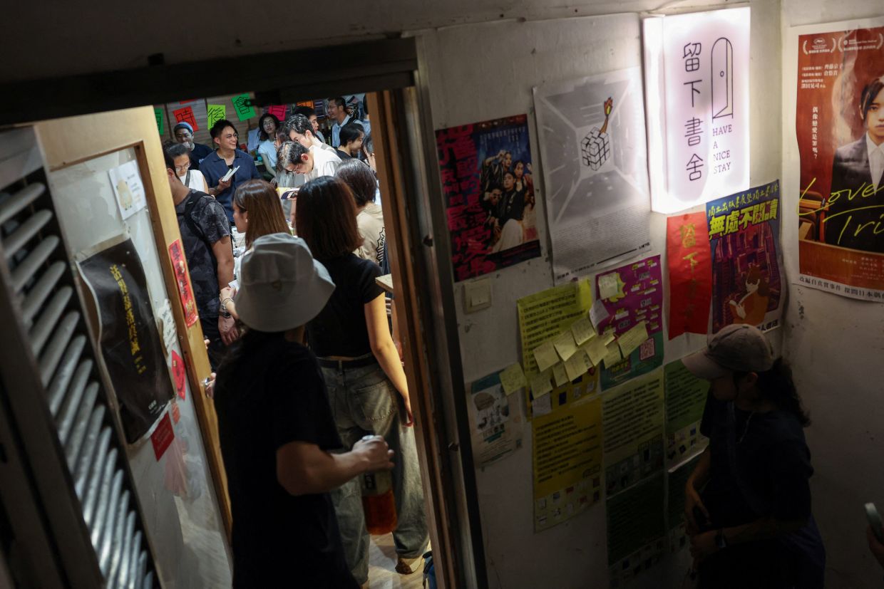 Customers inside the crowded space of HK independent bookstore Have a Nice Stay on its final day of operation on Aug 30. Photo: Reuters