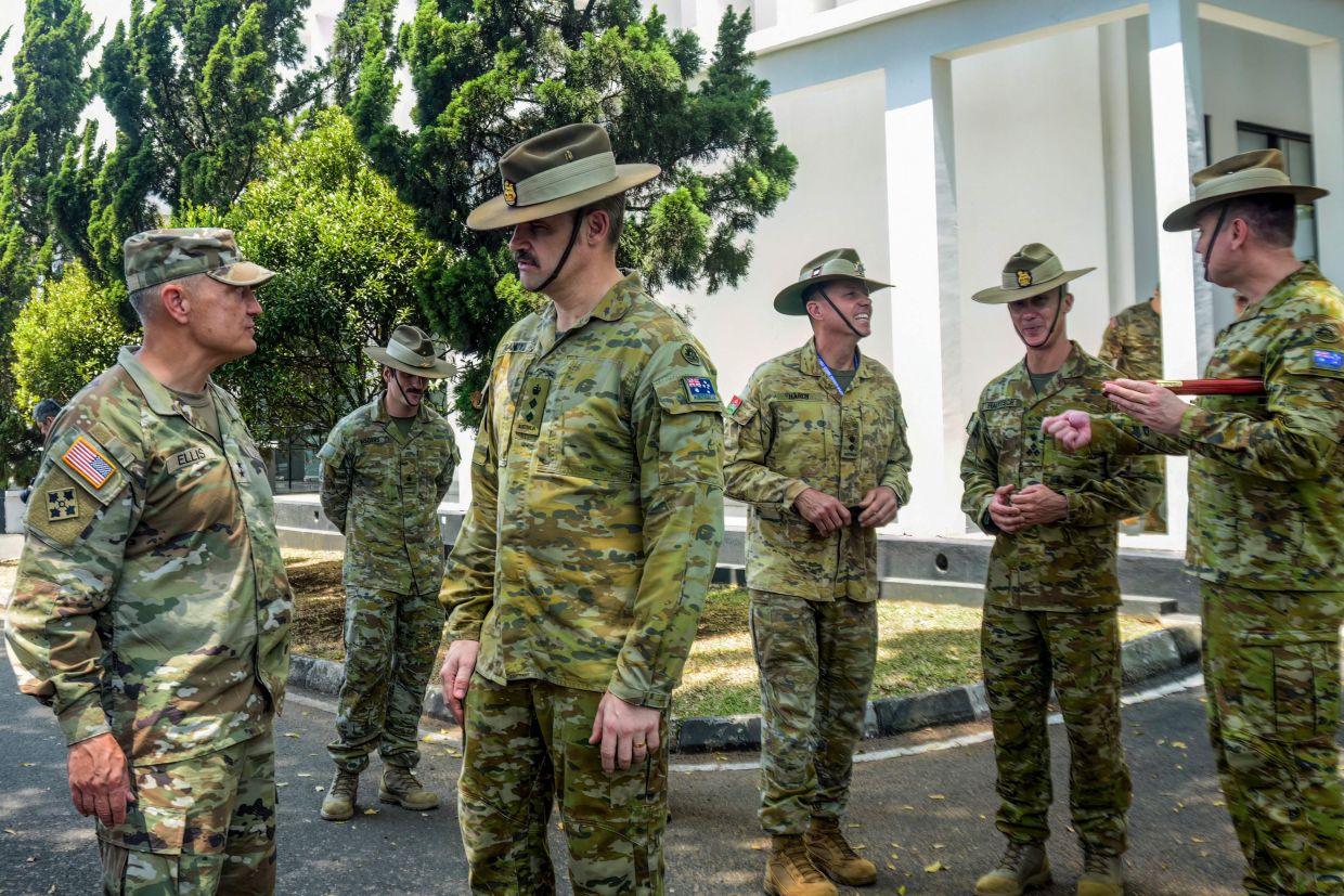 Major General Patrick J. Ellis from the US Fourth Infantry Division (left) talks with Colonel Dave Gandy, Australian Military Attache to Indonesia (2nd L) after the Super Garuda Shield 2026 Joint Exercise opening ceremony in Bandung, West Java, on Monday, August 31, 2026. 4,700 soldiers from 21 countries' armed forces participated in the Super Garuda Shield 2026 Joint Exercise, which is held in several locations, including Sumatra and Borneo islands. -- Photo by TIMUR MATAHARI / AFP