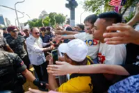National Day: Spectators surprised, thrilled as PM Anwar mingles with them after parade