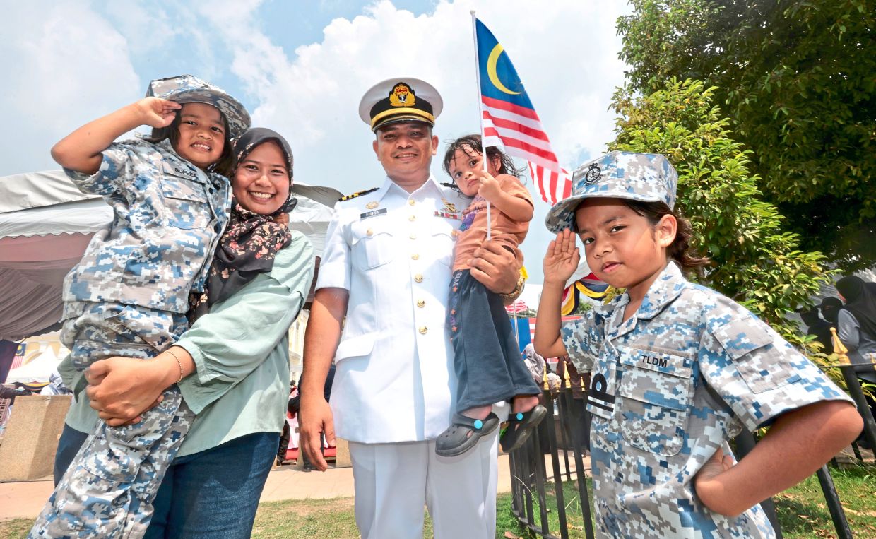 Little ‘Navy’ sisters add charm to Penang parade