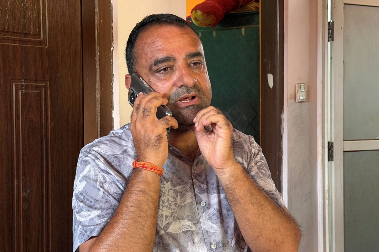 Rajendra Dawadi, headmaster of Tribhuvan Trishuli Secondary School, speaks on his mobile phone inside his house after he and his colleagues evacuated 1,643 students from the school approximately 10 minutes before flash floods destroyed the school building, in Nuwakot, Nepal, August 31, 2026. Picture taken with a mobile phone. - Photo: Reuters