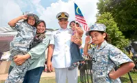 Little ‘Navy’ sisters add charm to Penang parade