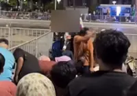 Police seek man involved in National Day crowd scuffle