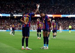 Soccer-Raphinha and Lamine doubles lift Barcelona past Rayo Vallecano