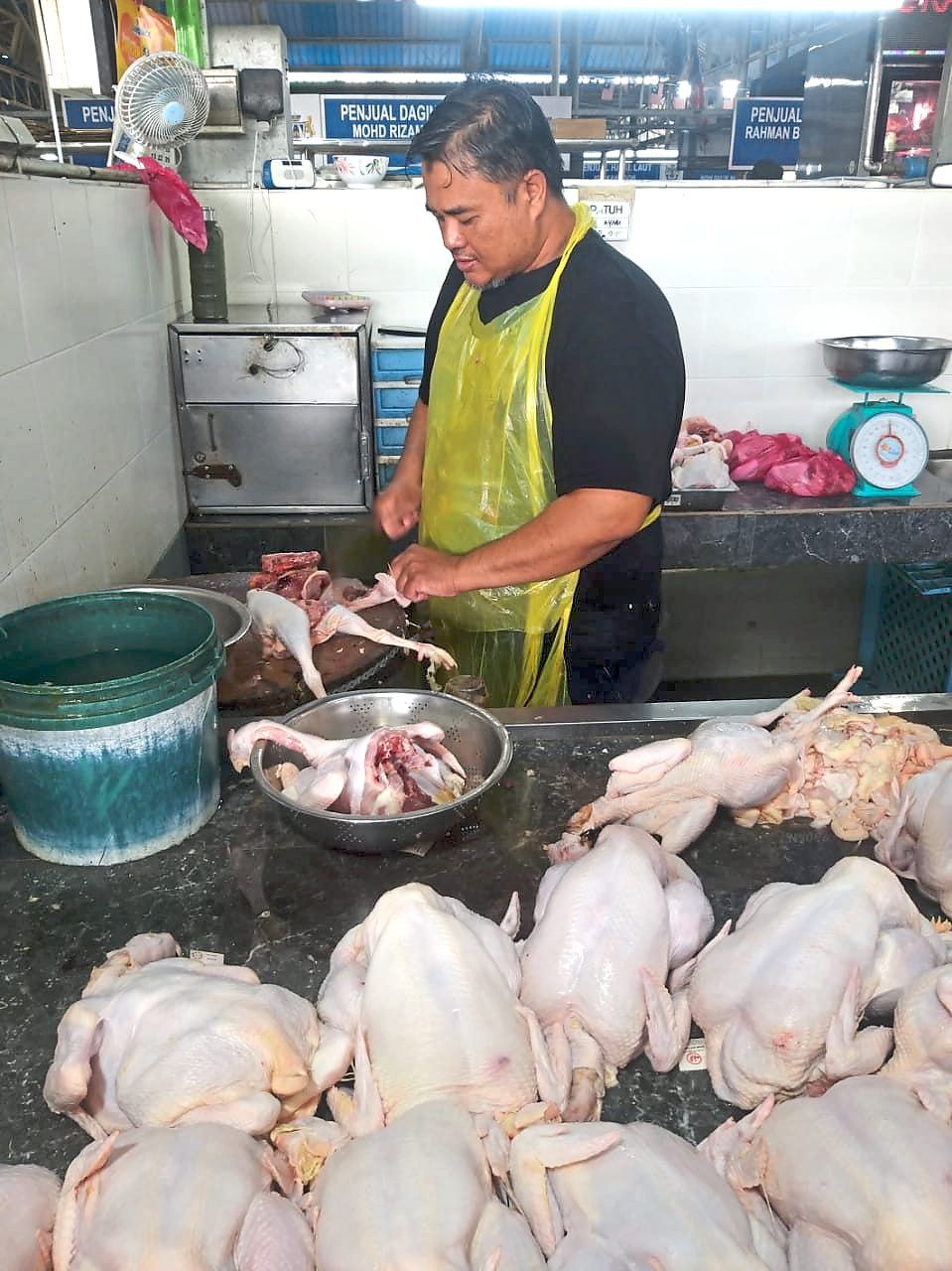 Nor Mohd Azahari has to absorb the rising cost of plastic bags.