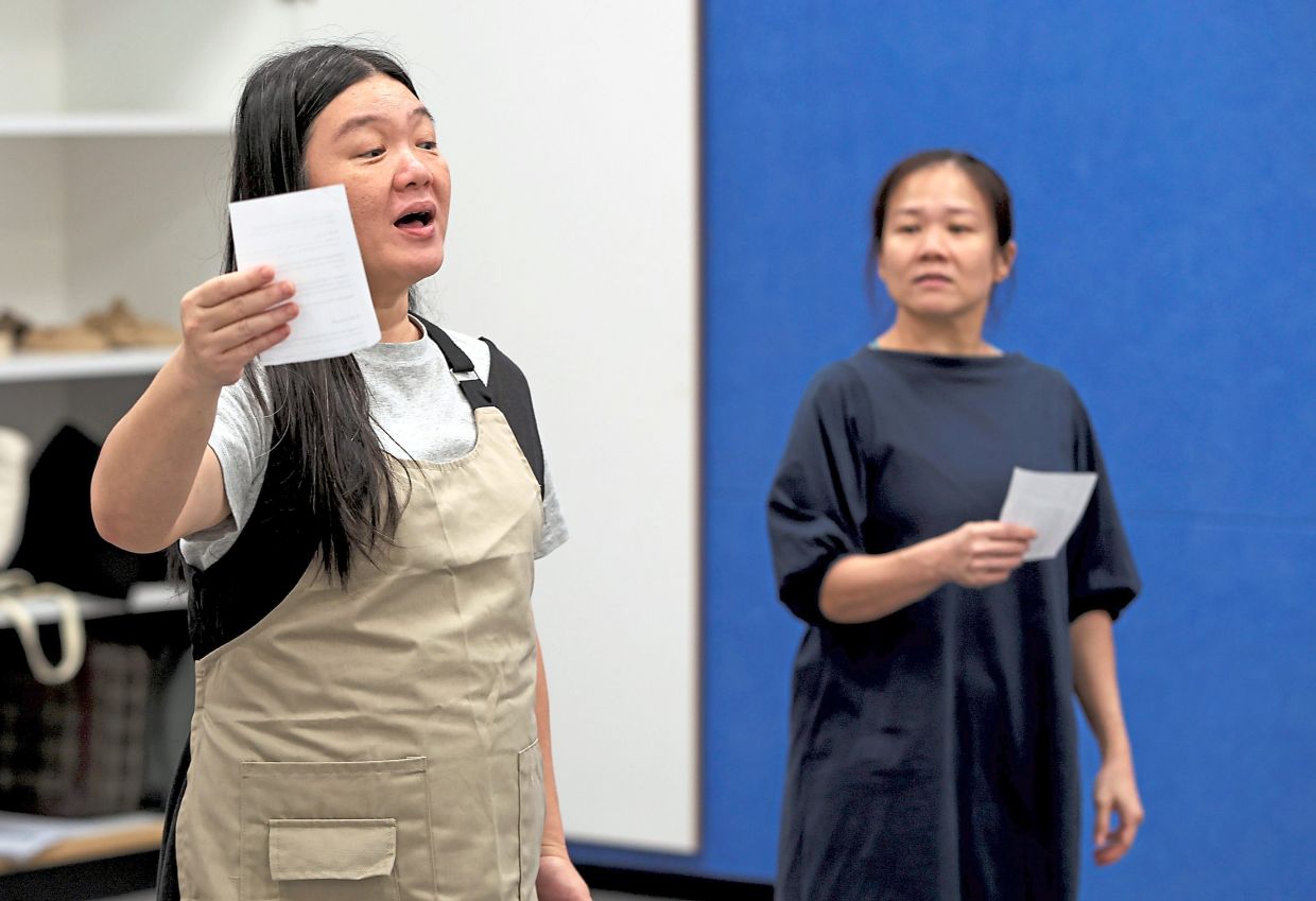 In 'The Secret Drawer', writer-performers Tang (left) and Lim carry their family stories to the stage, revealing a shared history that may resonate with many Malaysians. Photo: The Star/Chan Tak Kong 