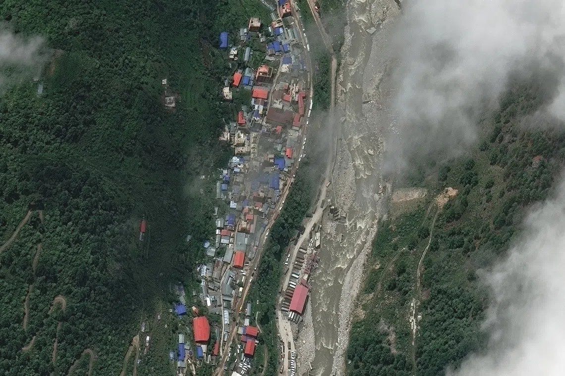 A satellite image shows buildings and roads before flash floods and a mudslide, in Timure, Nepal, July 1, 2026. - Photo: Reuters