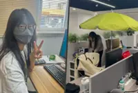 Chinese workers use parasols and sunscreen indoors to combat ‘office ageing’