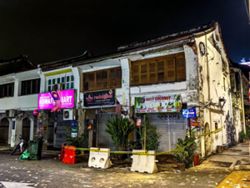 Woman hurt after cement debris dislodges from heritage building in Penang