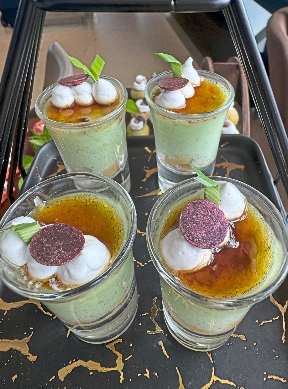 The Pandan Onde Onde Mousse features a chocolate disc and piped cream.