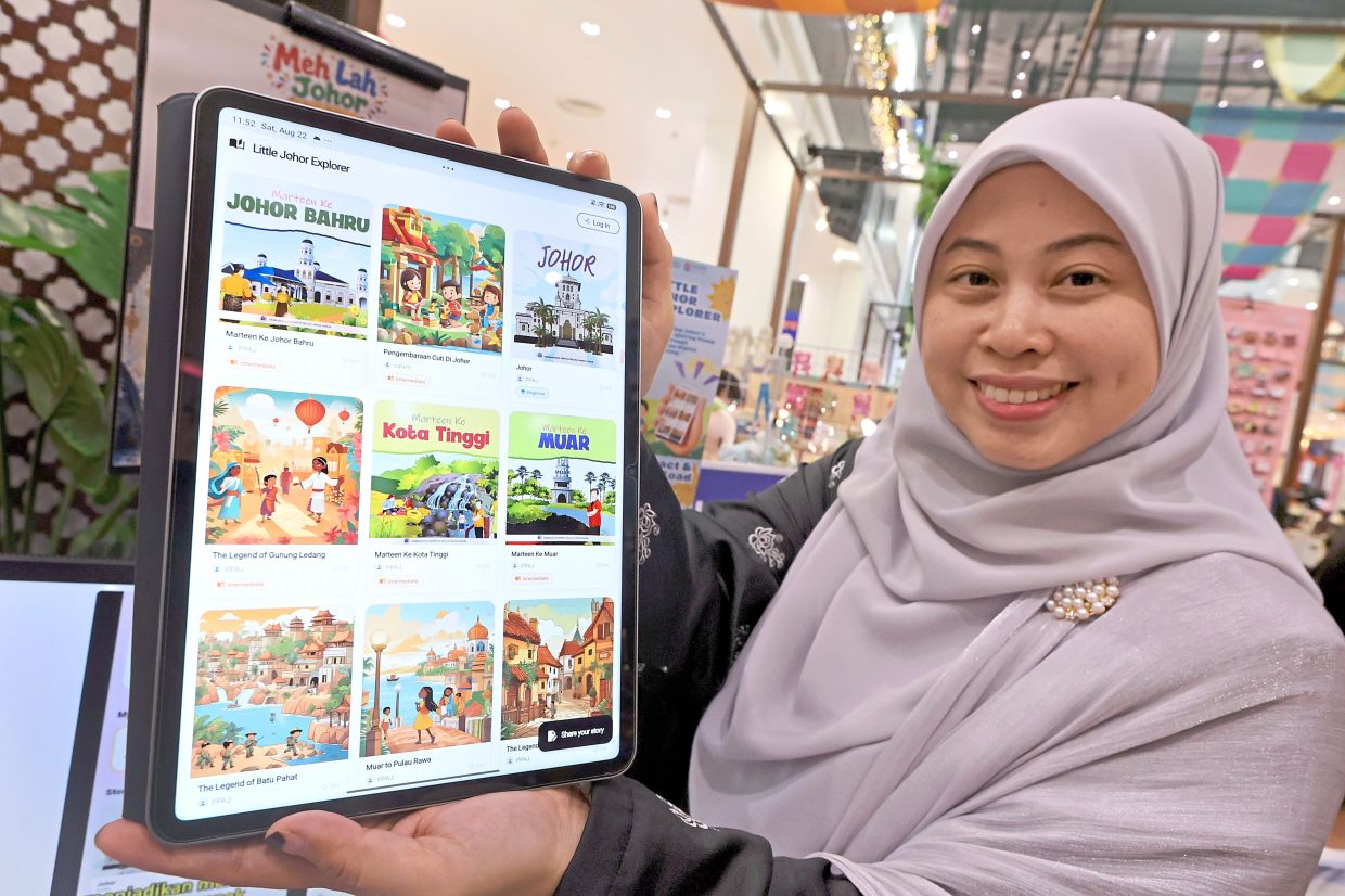 Shafika showing the mobile application she has created.