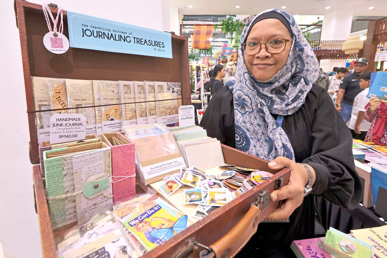 Emila with some journalling supplies she made for fellow enthusiasts.