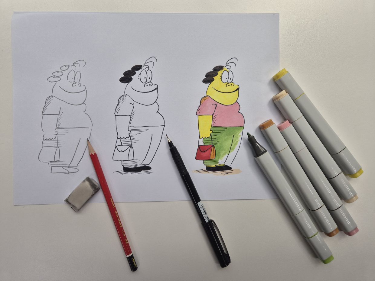 Kee’s comics take shape through a simple yet carefully honed three-step process: sketching, inking and colouring. Photo: The Star/Sheela Chandran